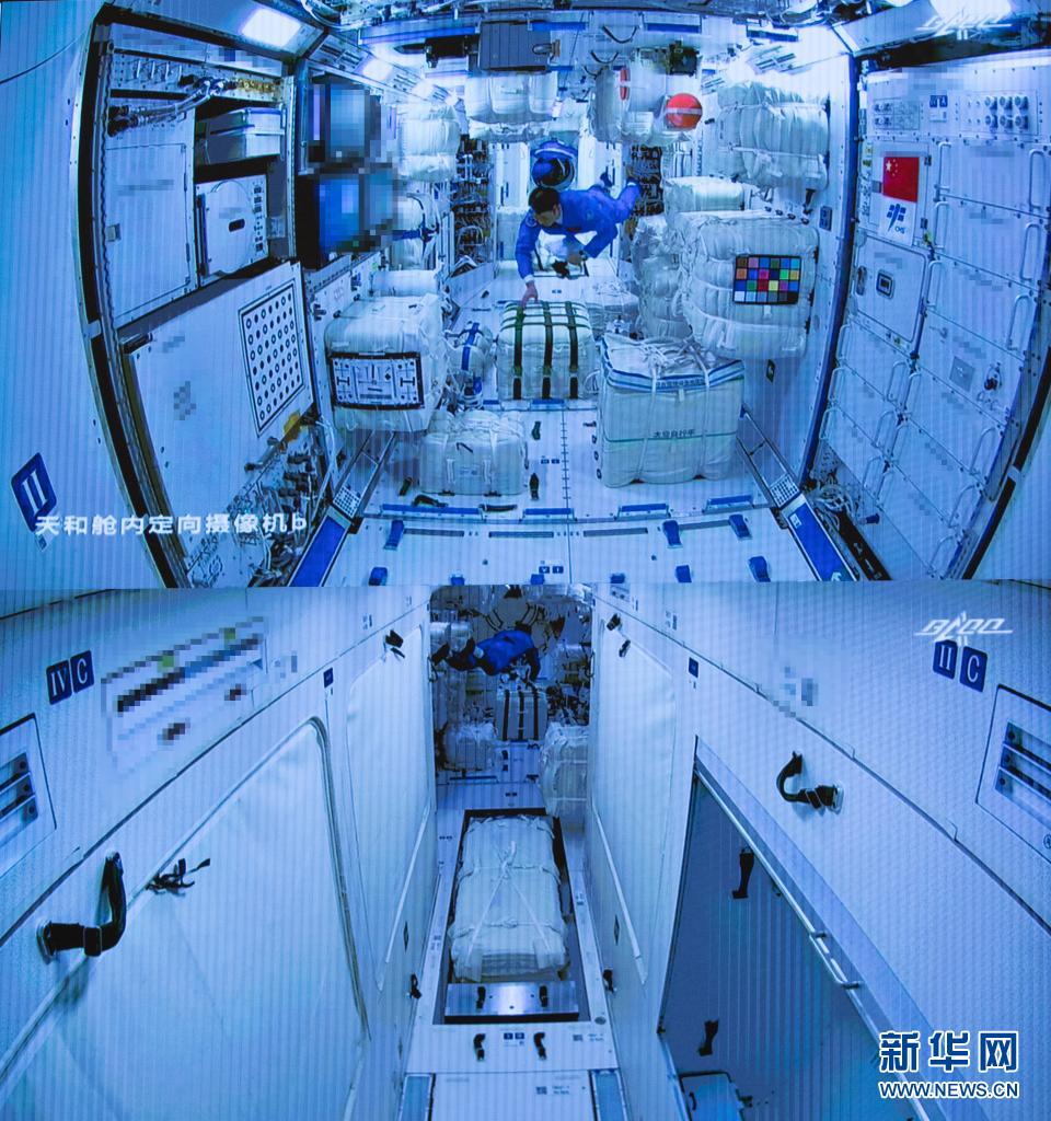 6月17日在北京航天飞行控制中心拍摄的神舟十二号载人飞船航天员乘组进驻天和核心舱的画面。新华社记者 金立旺 摄
